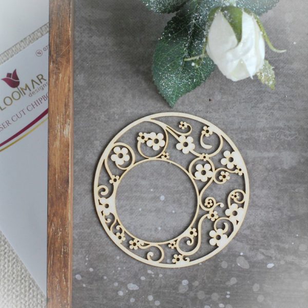 decorative laser cut chipboard round frame with lots of little flowers and swirls