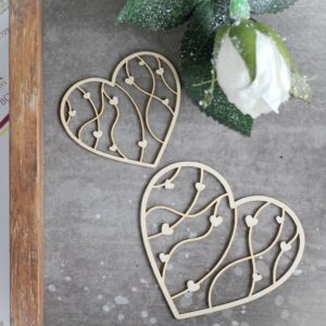 set of two decorative laser cut chipboard hearts with tiny hearts inside