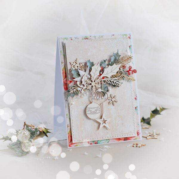 handmade christmas card with laser cut baubles and snowflakes