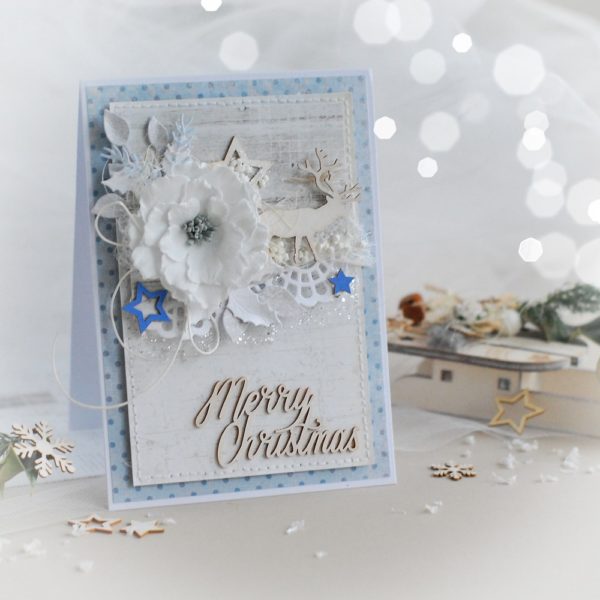 Merry christmas handmade card with reindeer, stars and flower
