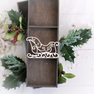 christmas decorative satna sleigh withswirls and snowflakes