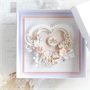 personalised handmade first holy communion card decorated with layered heart shaped frame and host motif